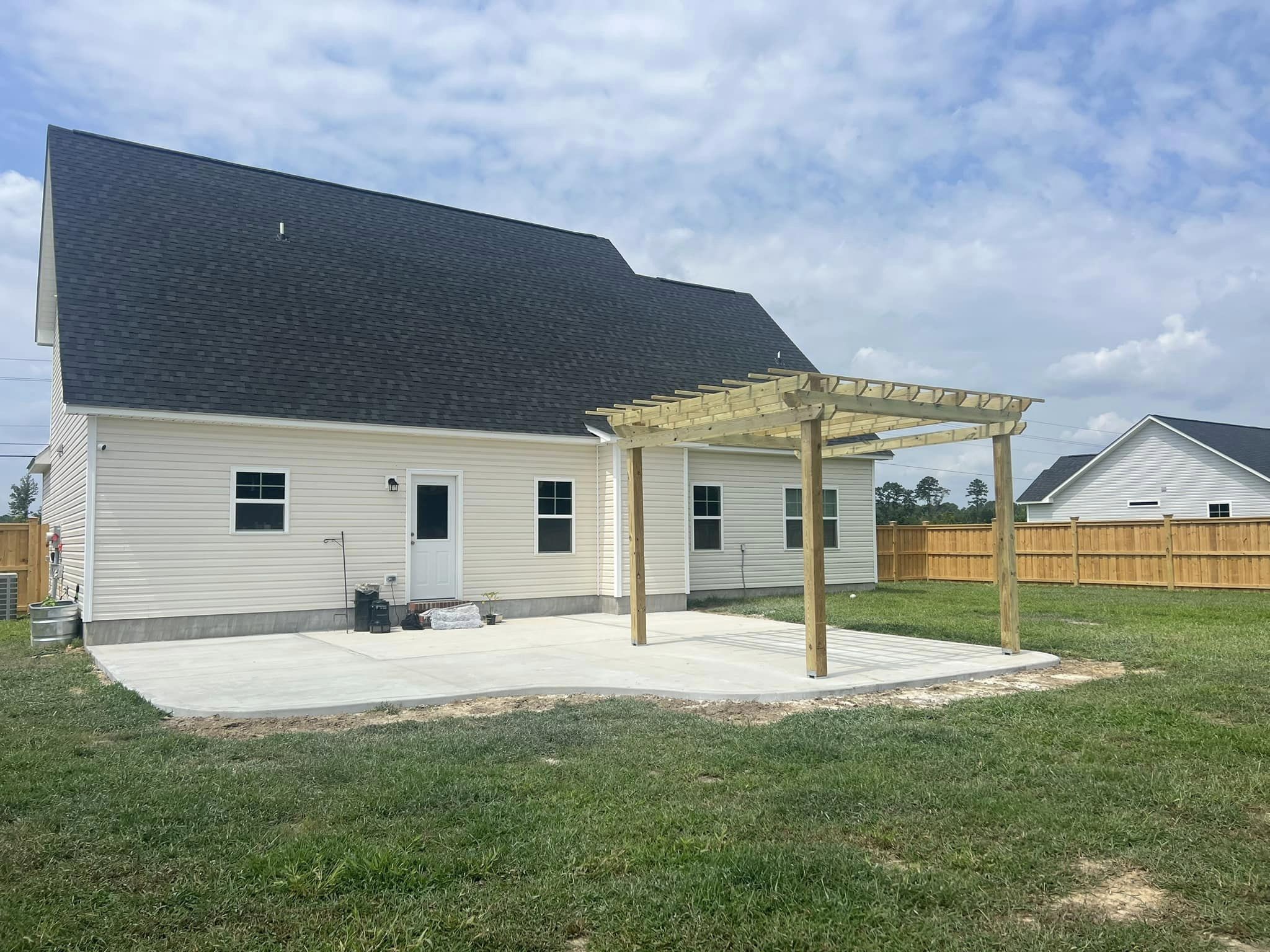 pergola and concrete pato installation for a backyard