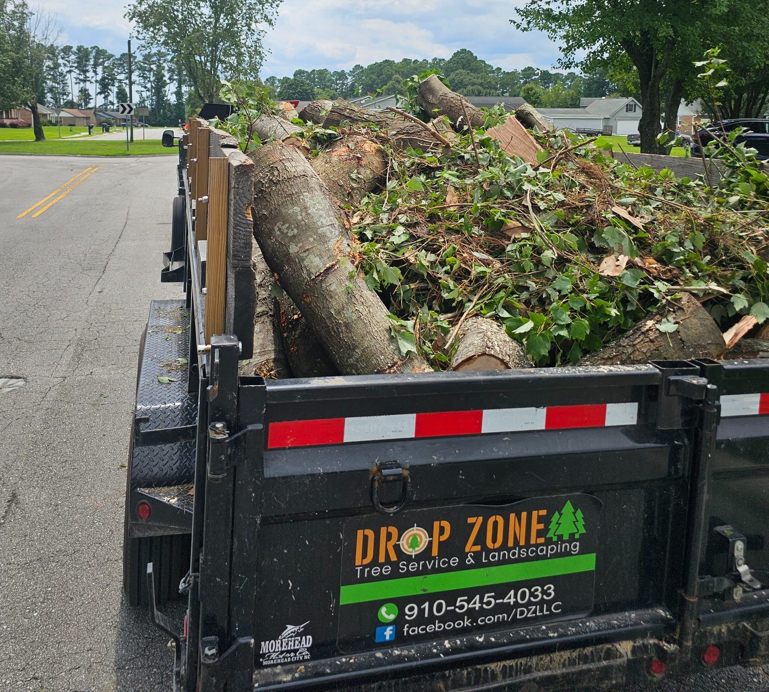 large amounts of debris loaded in to a dump truck